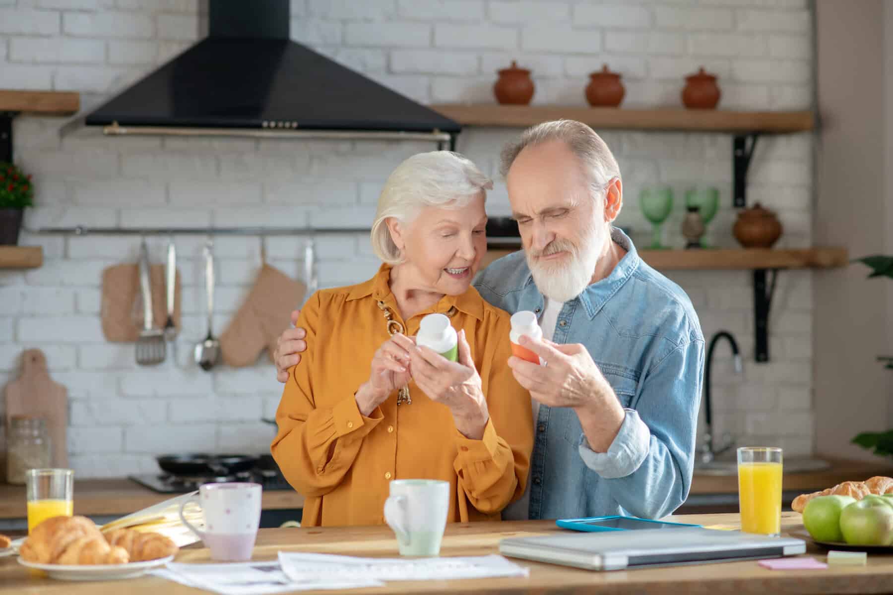 Elderly couple comparing supplements